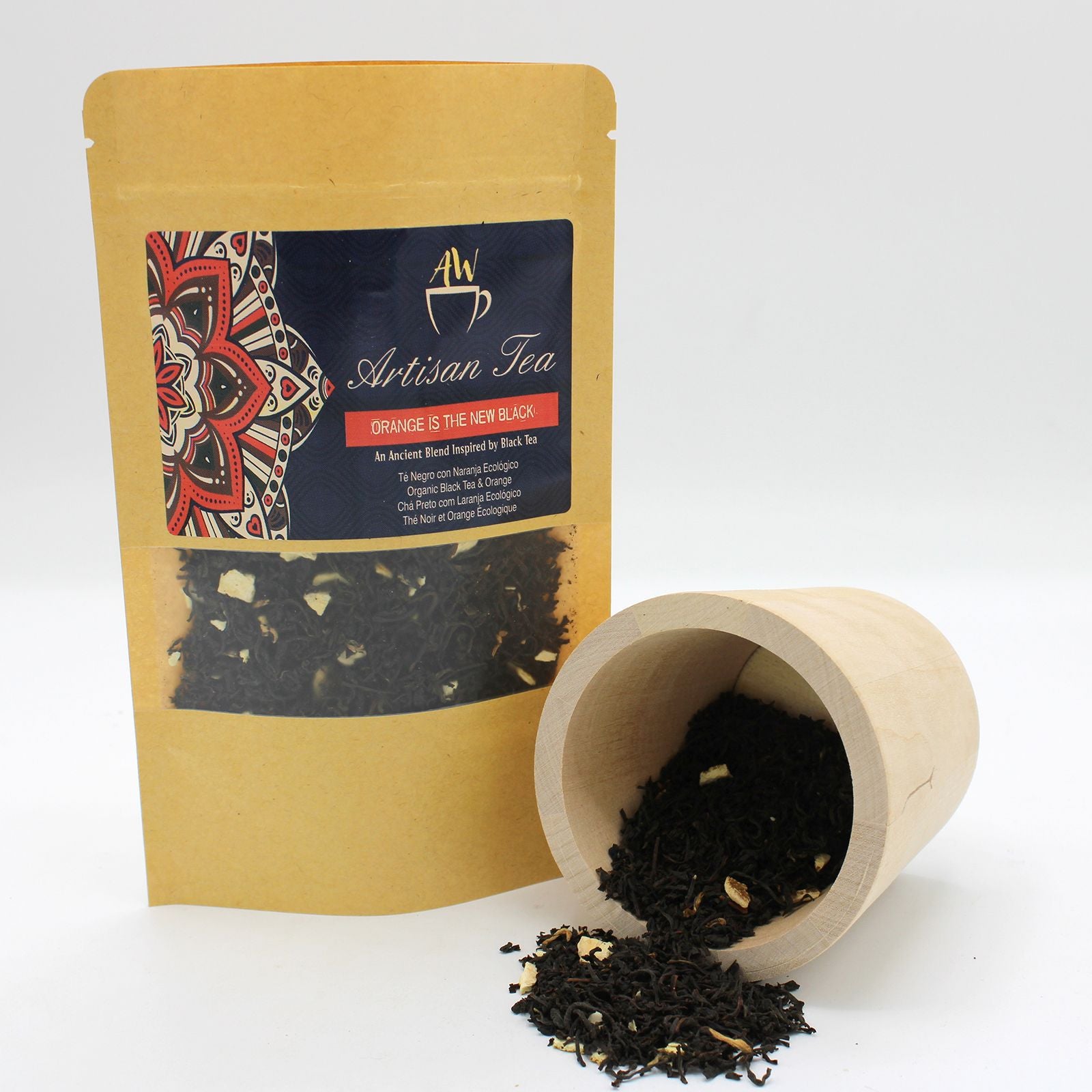Artisan Tea package with a wooden scoop and tea leaves on a white background
